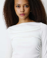 Top asymétrique manches longues bas en dentelle ivoire Bina