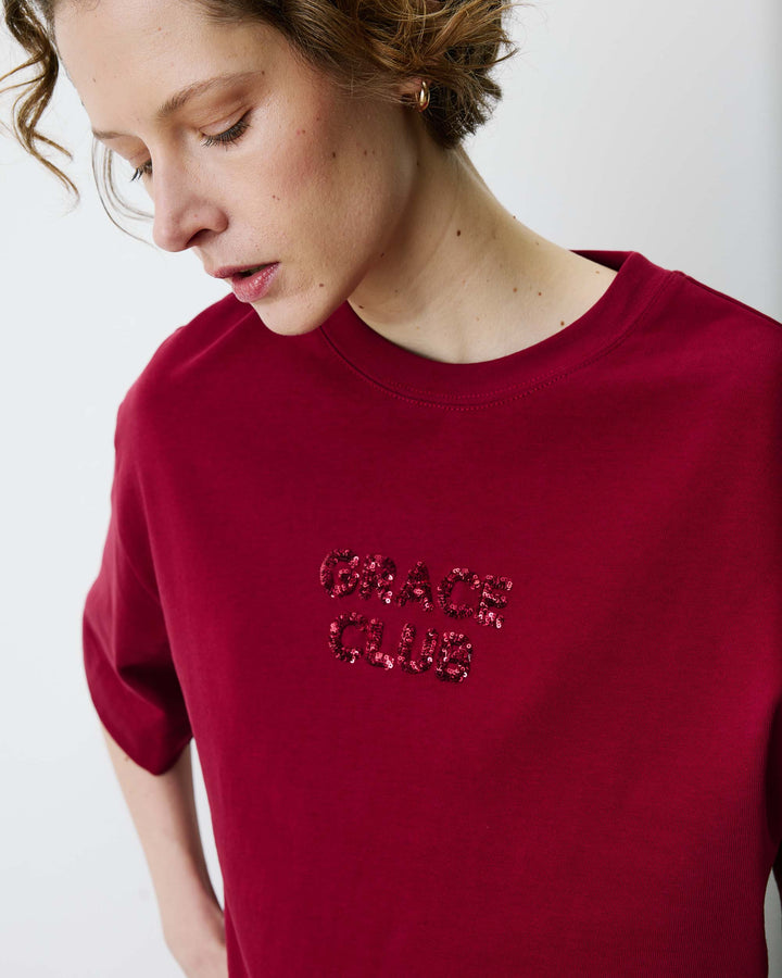 Camiseta con mensaje de lentejuelas cherry Bond